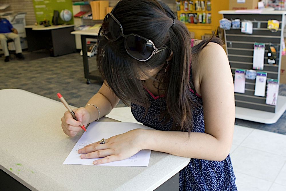 June sketching an idea by hand, reflecting the design-first process behind YJune Studio.