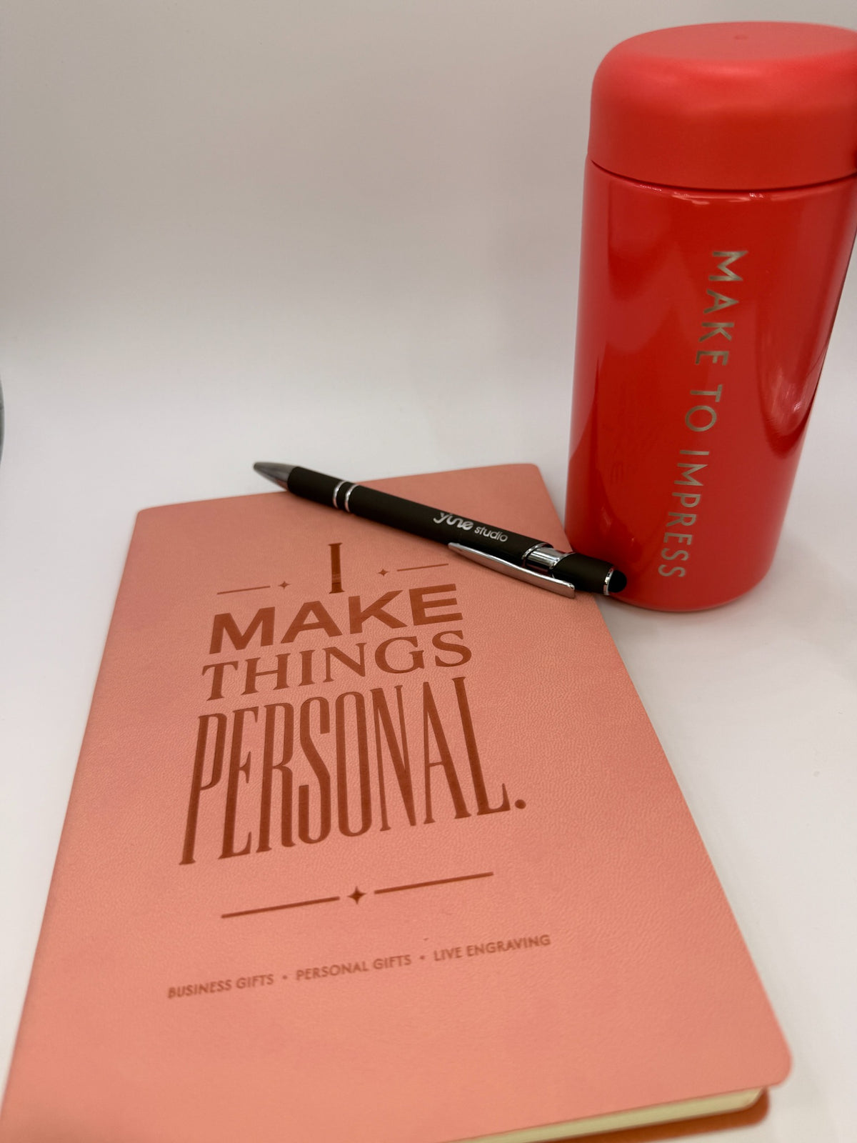 YJune Studio sample set with personalized notebook, pen and drinkware for business gifting inspiration.