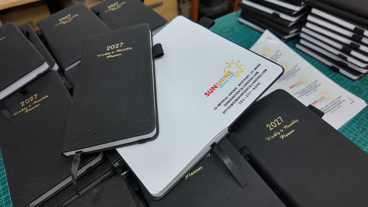 Sunshine Dental planners sourced and branded for a business gifting program by YJune Studio.