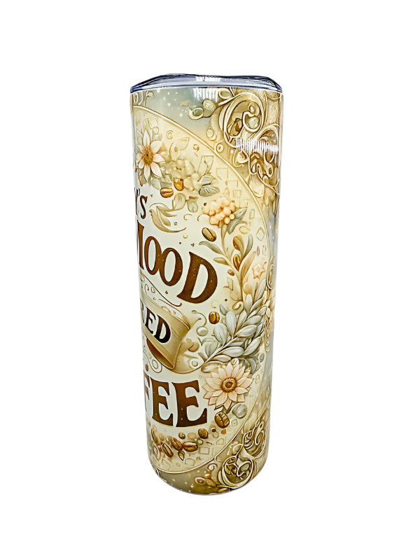Tumbler with decorative design and text on a white background