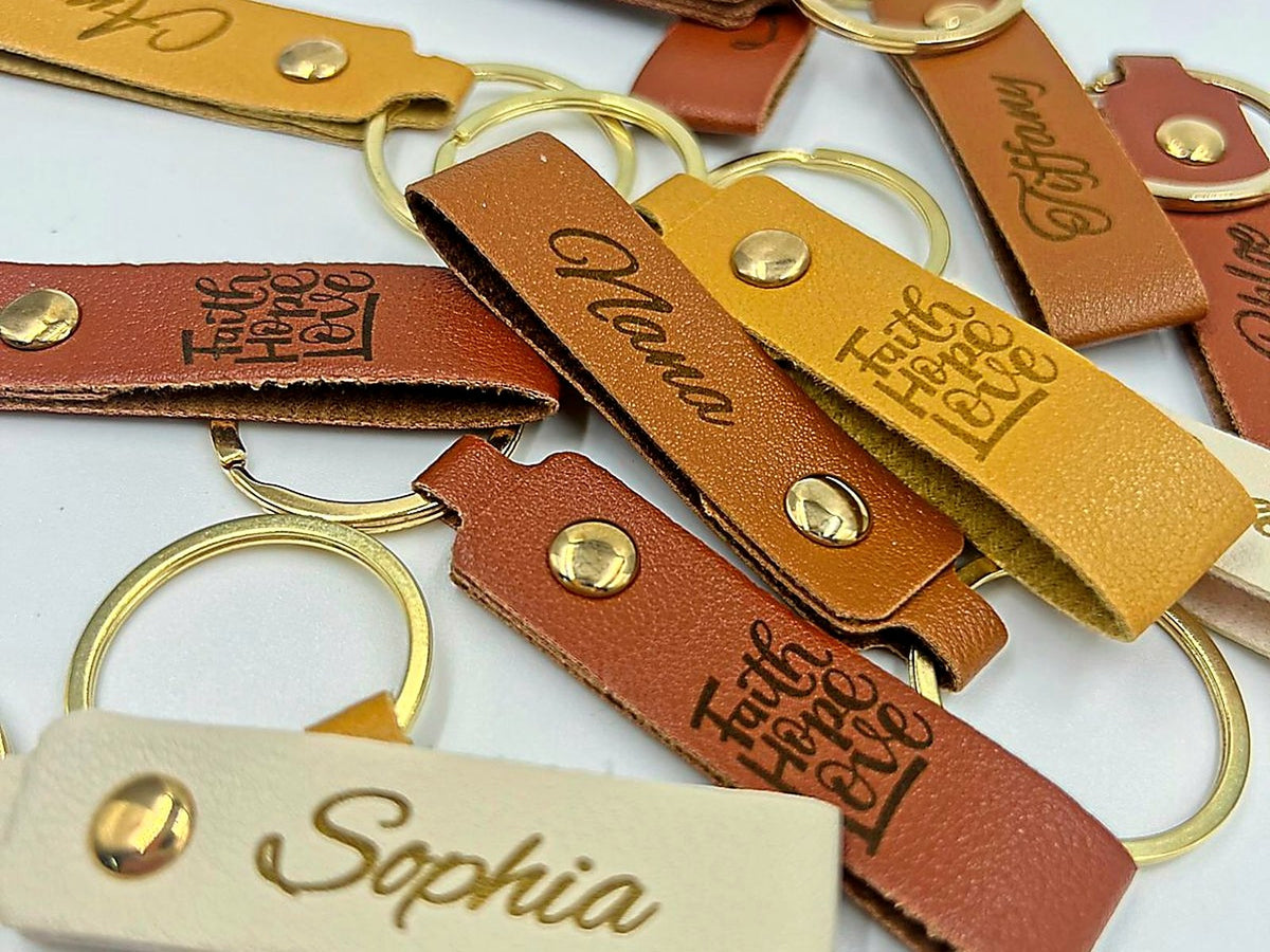 Personalized leatherette keychain examples for YJune Studio live engraving.